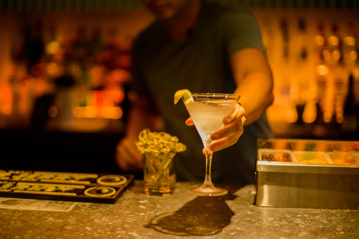 A man serves a cocktail