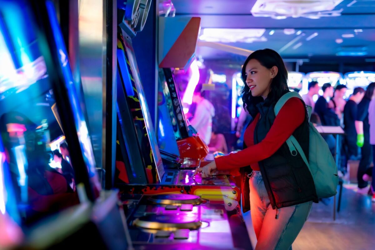 woman playing a game at an arcade in New Jersey