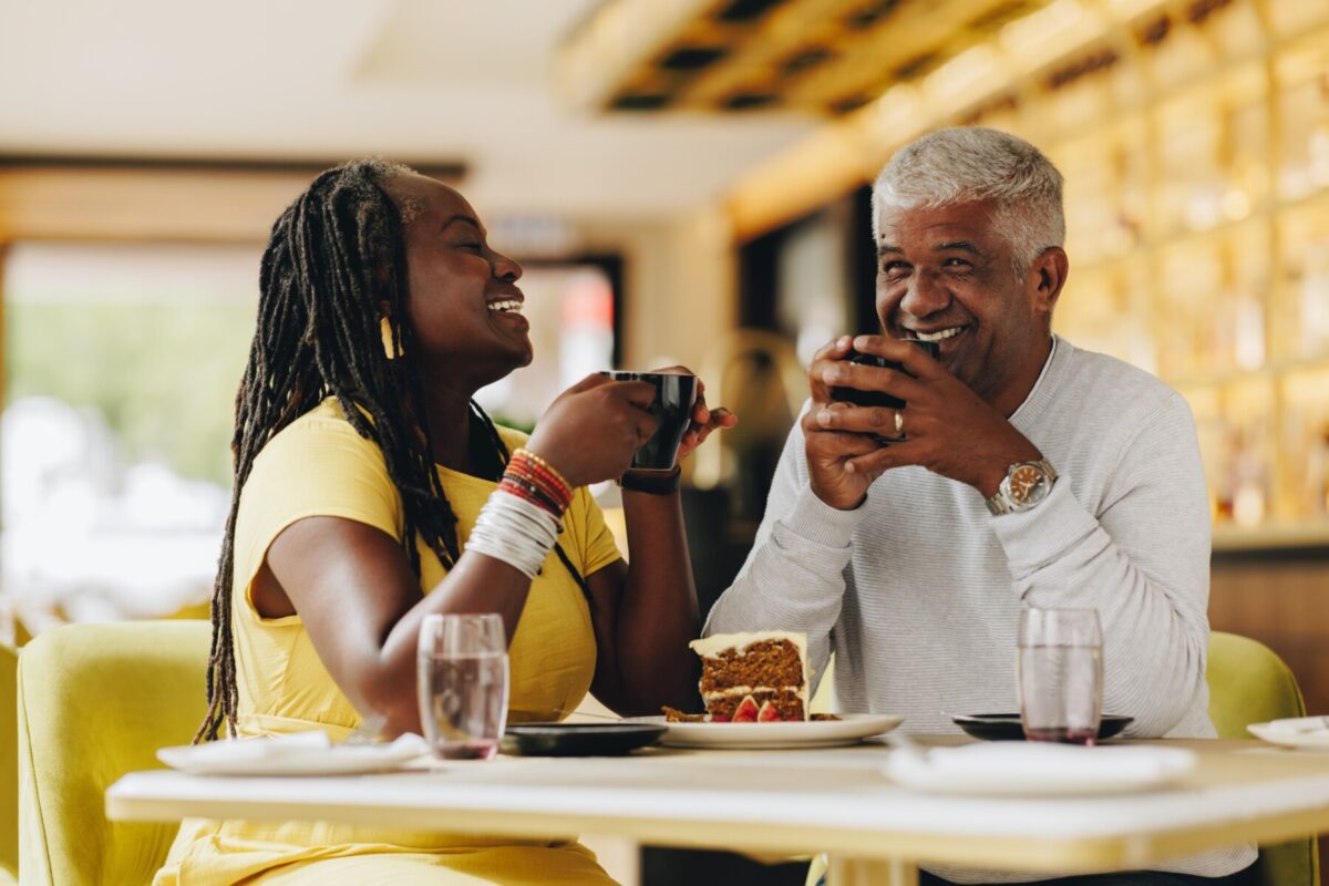 couple having cake and coffee at restaurant